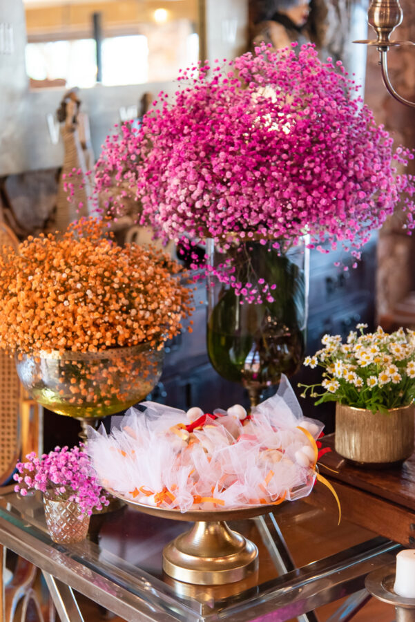 Traditional sweet on the candy bar with flower arrangements