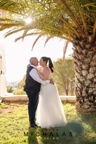 Sunset wedding ceremony on a cliff overlooking the sea