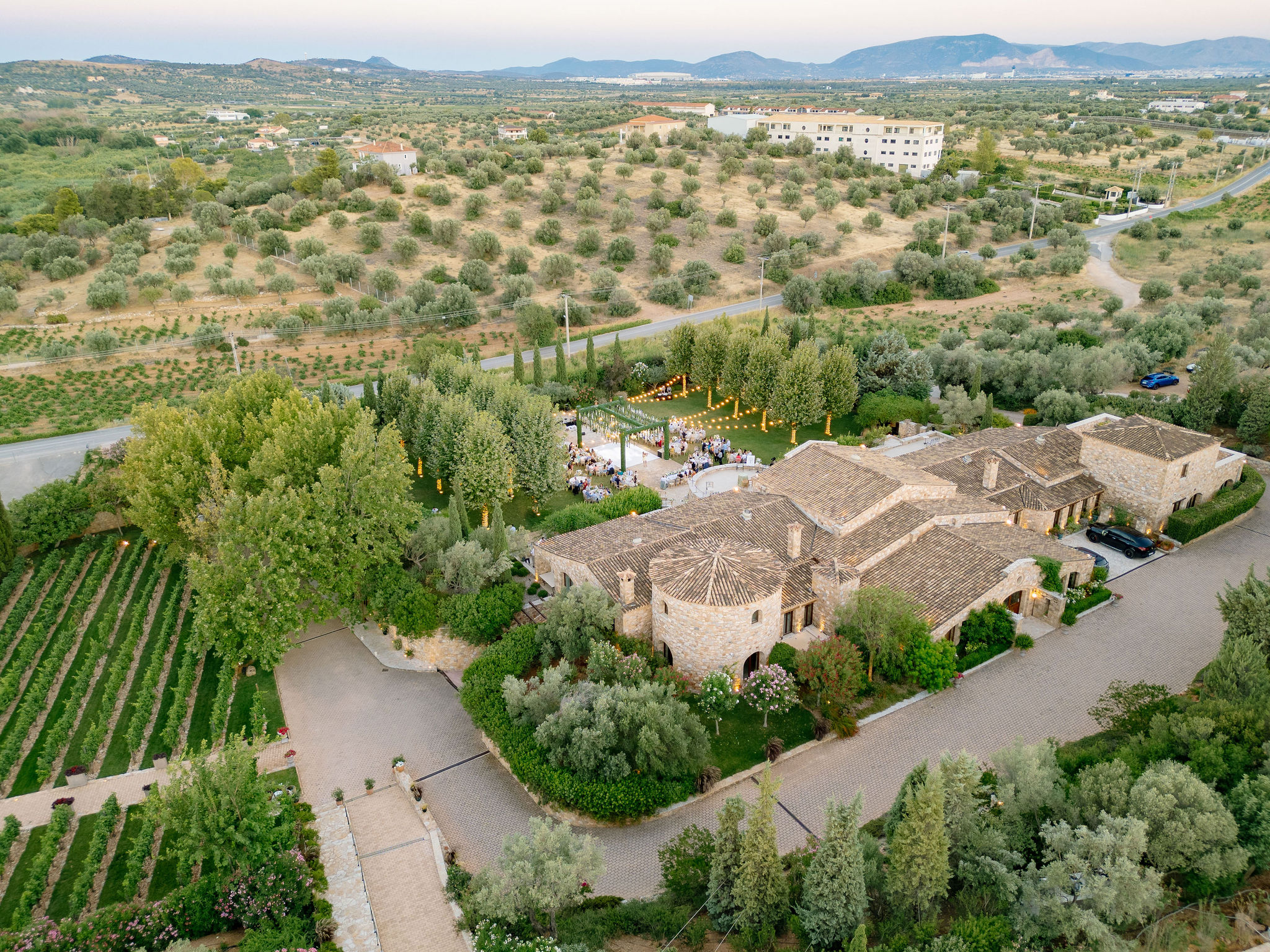Luxury wedding details with white flowers and chandeliers at Pyrgos Petreza
