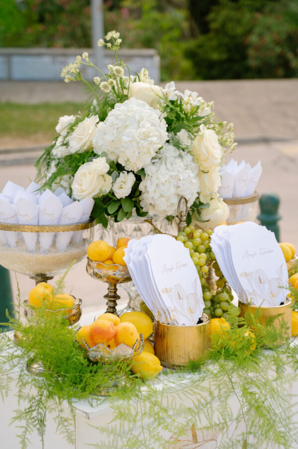 Wedding cake decorated with fresh flowers and greenery