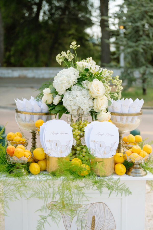 Luxury wedding details with white flowers and chandeliers at Pyrgos Petreza