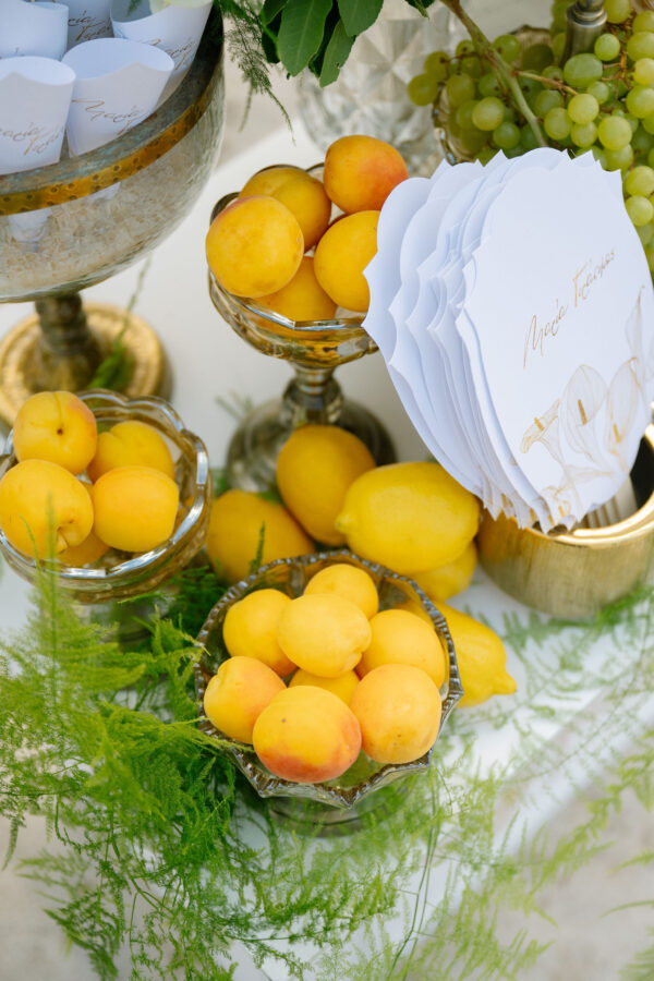 Wedding cake decorated with fresh flowers and greenery