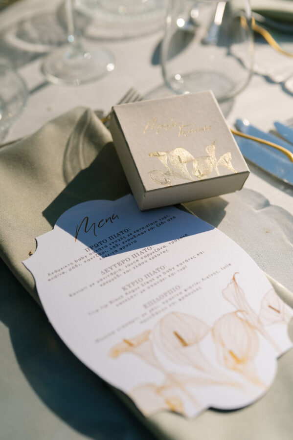 Wedding cake decorated with fresh flowers and greenery