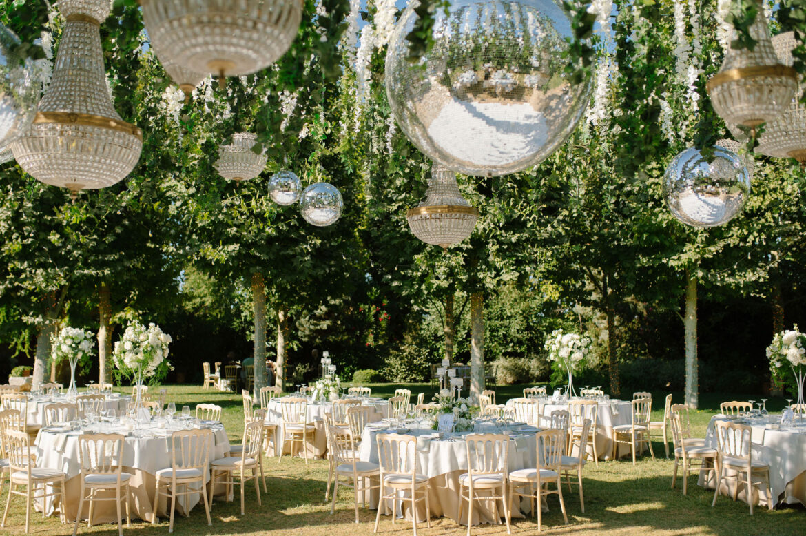 Wedding cake decorated with fresh flowers and greenery