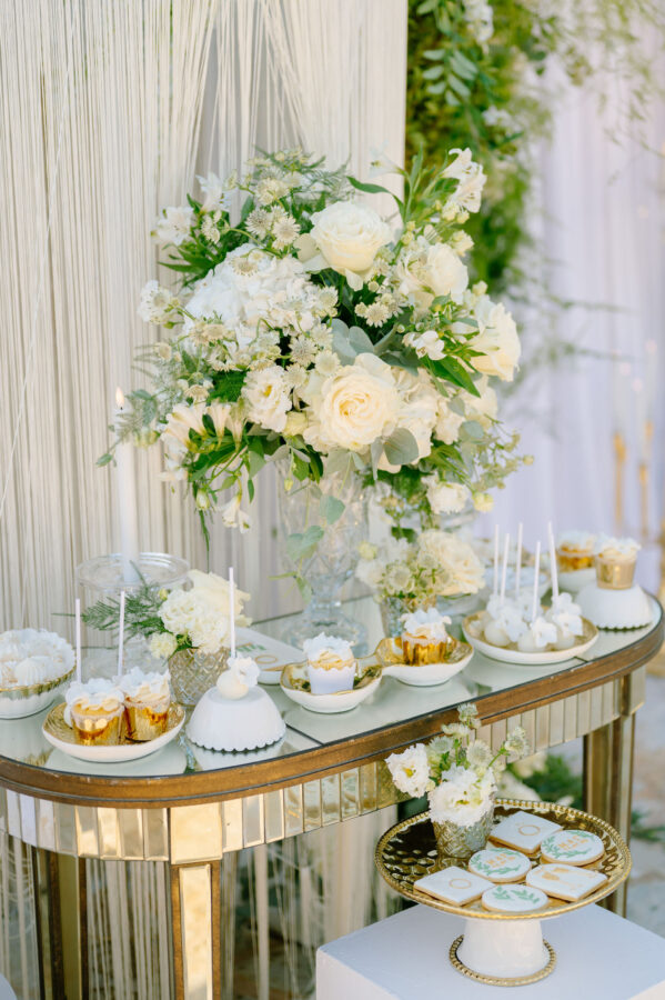 Luxury wedding details with white flowers and chandeliers at Pyrgos Petreza