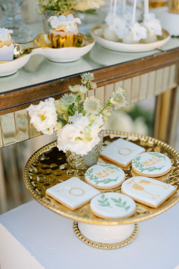Wedding cake decorated with fresh flowers and greenery