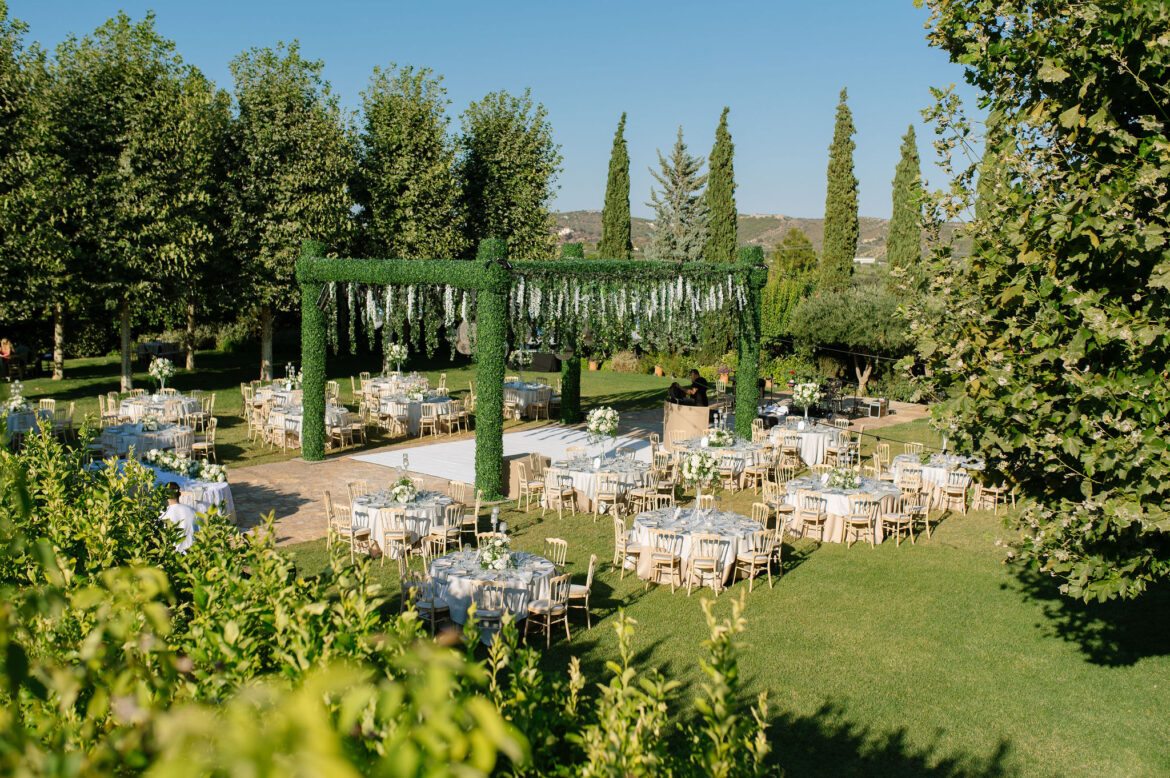 Luxury wedding details with white flowers and chandeliers at Pyrgos Petreza