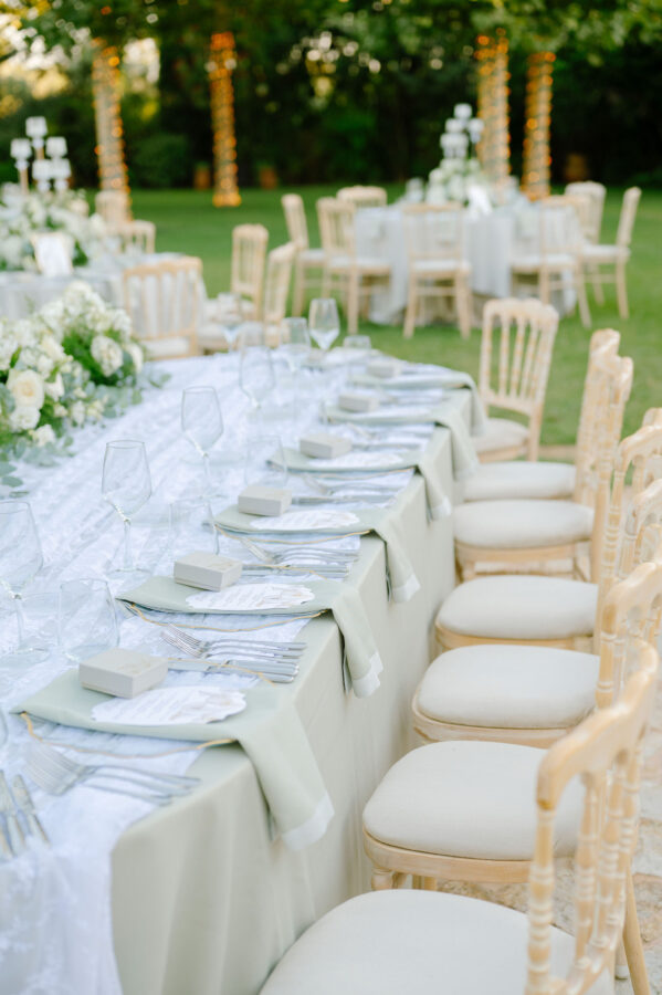 Wedding cake decorated with fresh flowers and greenery