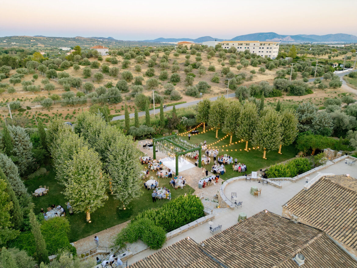 Luxury wedding details with white flowers and chandeliers at Pyrgos Petreza