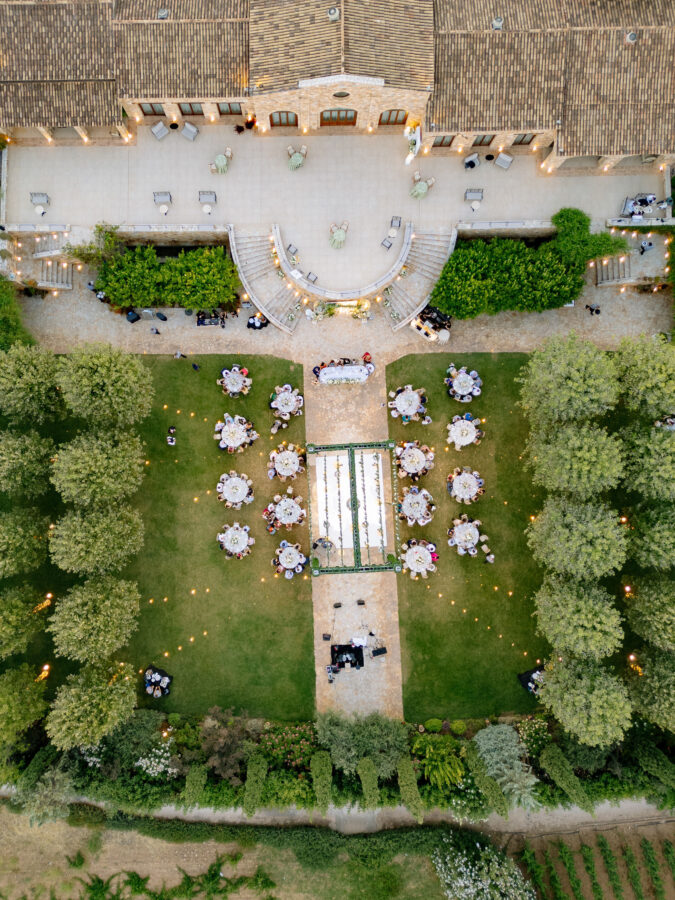 Wedding cake decorated with fresh flowers and greenery