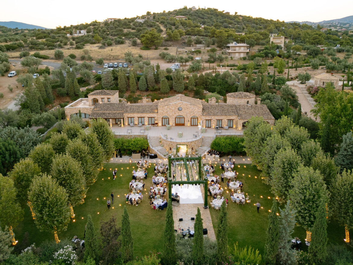 Luxury wedding details with white flowers and chandeliers at Pyrgos Petreza