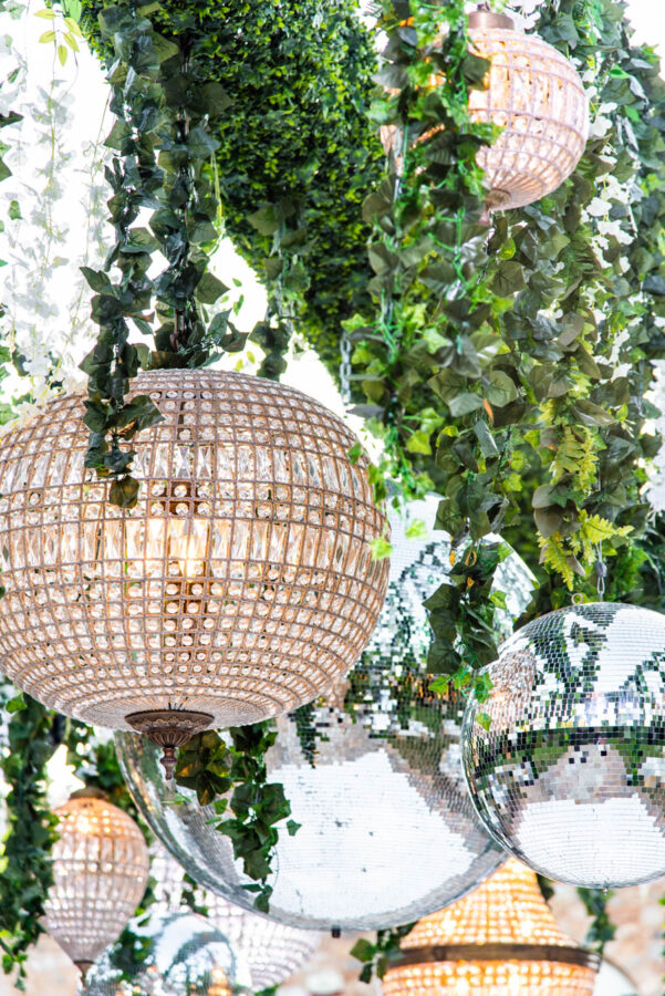 “Outdoor wedding reception with string lights and wooden tables