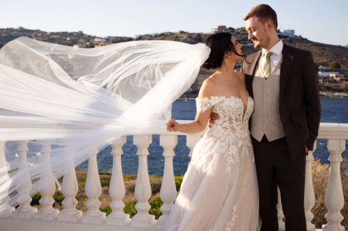 BRIDE HOLDING GROOM